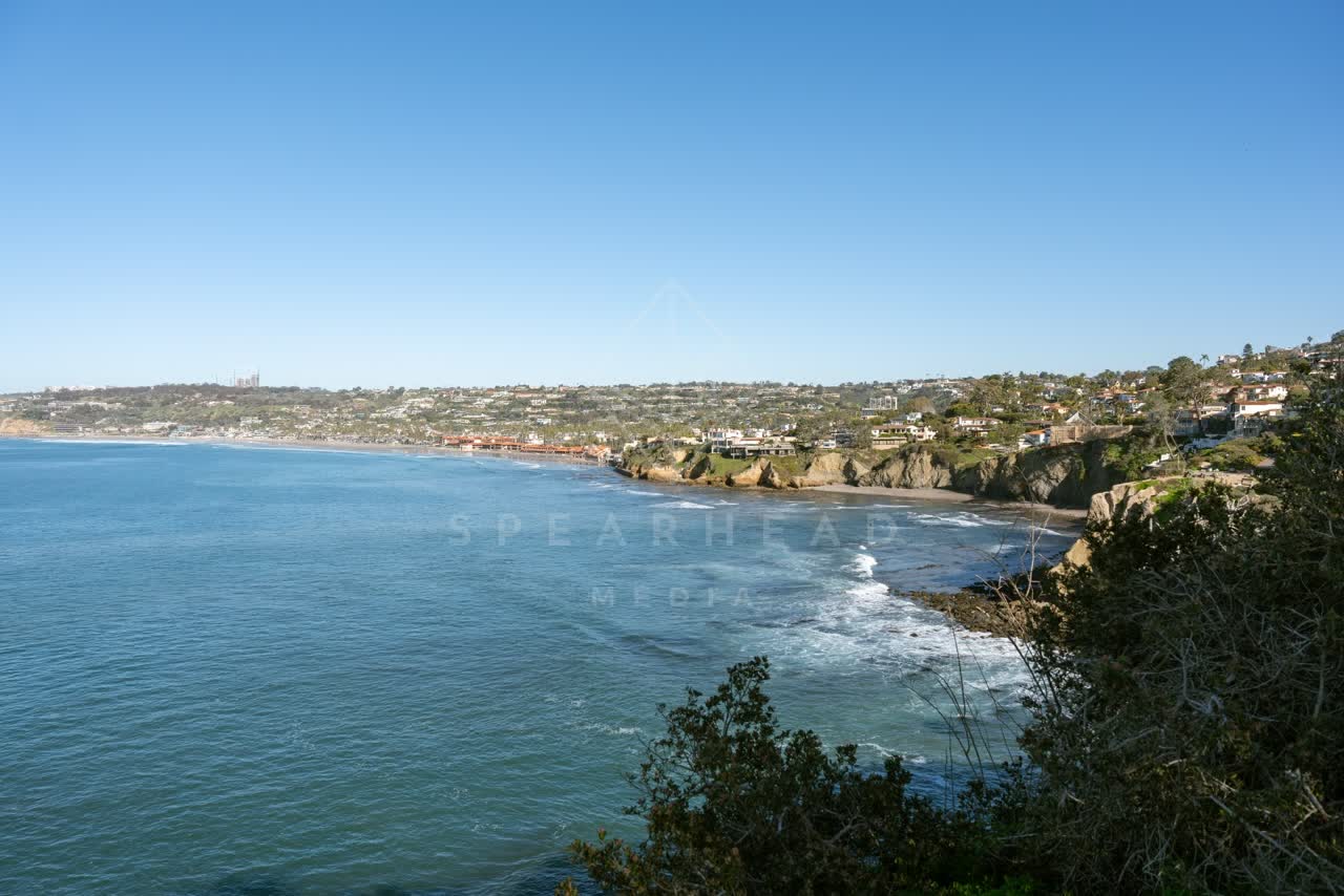 Elevated view of the cliffs, the ocean and homes at Coast Walk Trail.