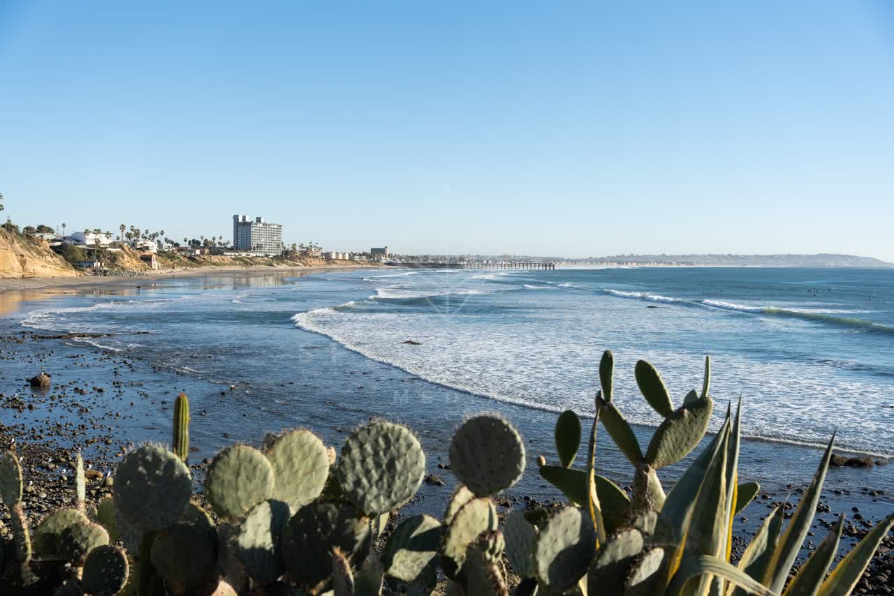 Elevated view of the cliffs, the surf and the pier at Bird Rock.
