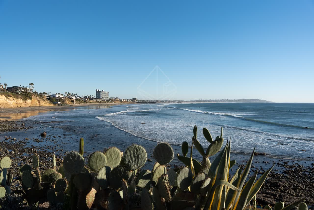Elevated view of the cliffs, the surf and the pier at Bird Rock.
