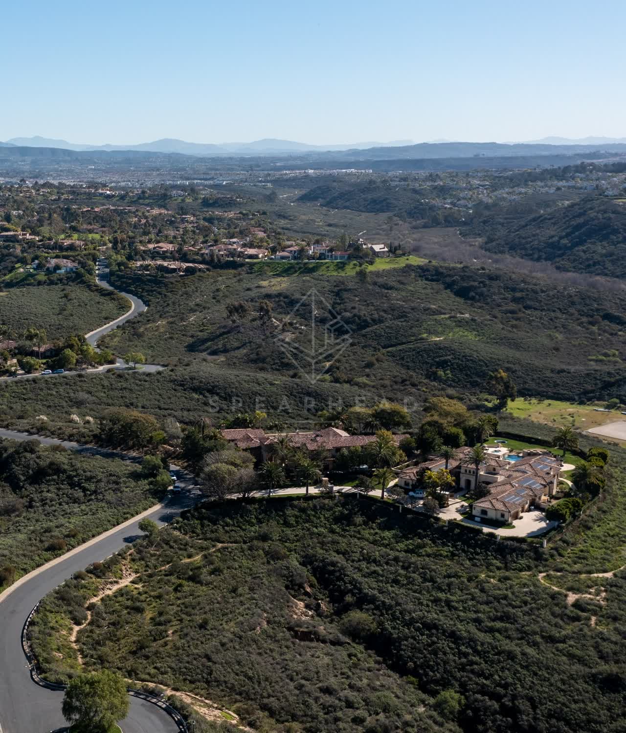 Aerial view of a residential street, homes and the buildings at Rancho Pacifica.