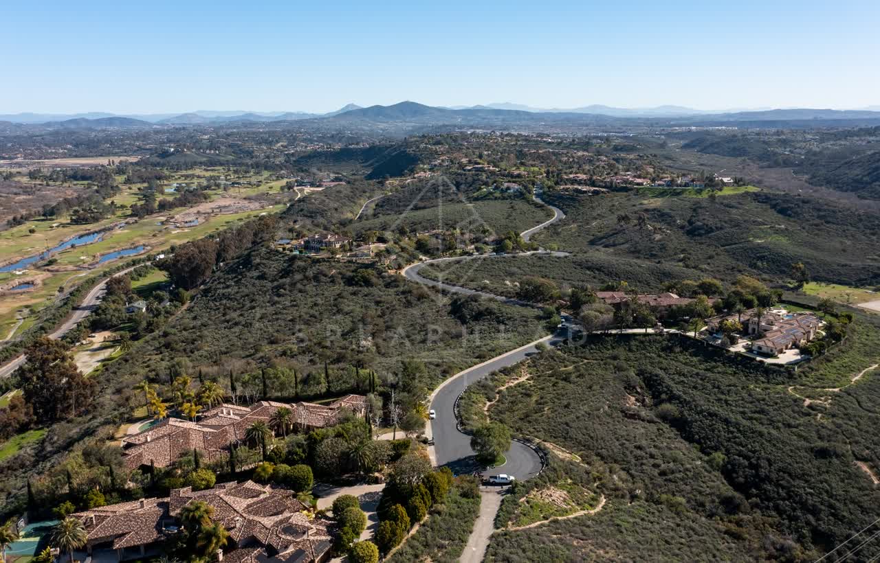 Aerial view of a residential street, homes and traffic at Rancho Pacifica.