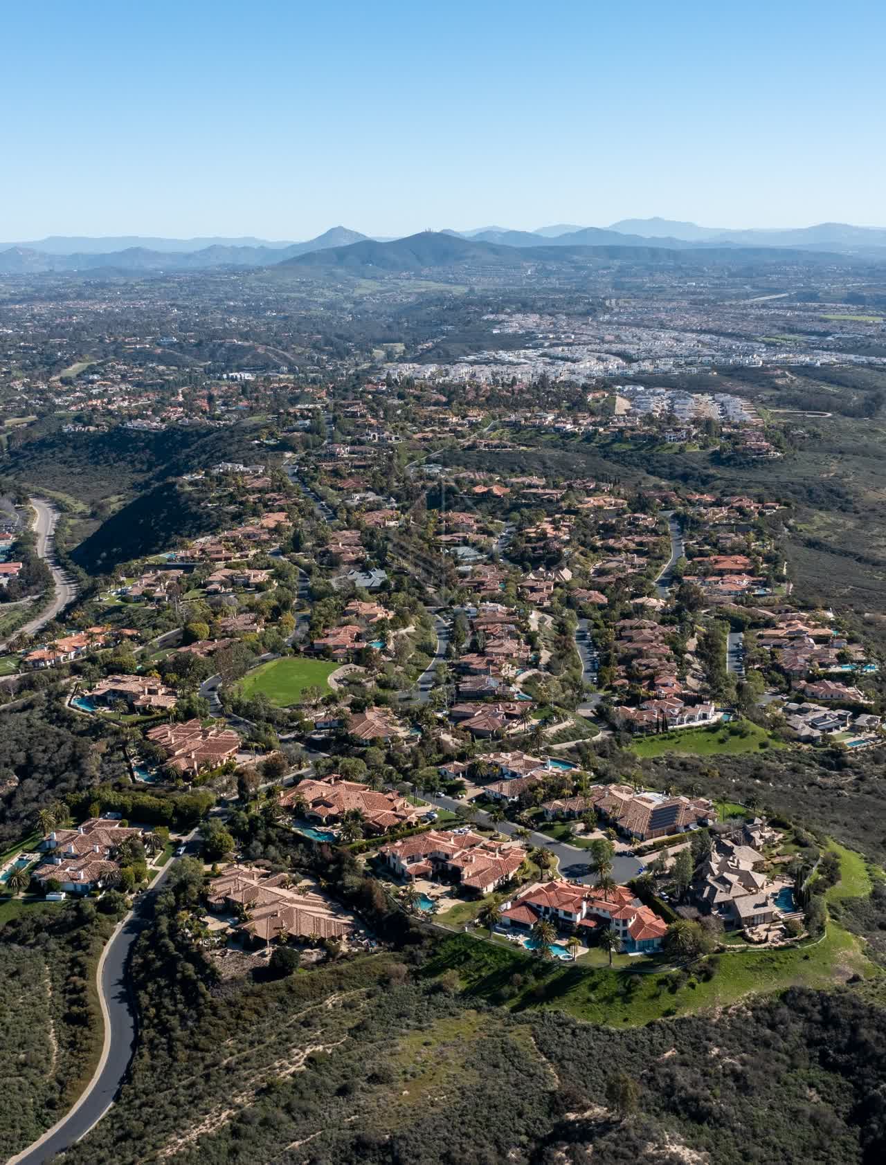 Aerial view of a residential street, homes and the buildings at Rancho Pacifica.
