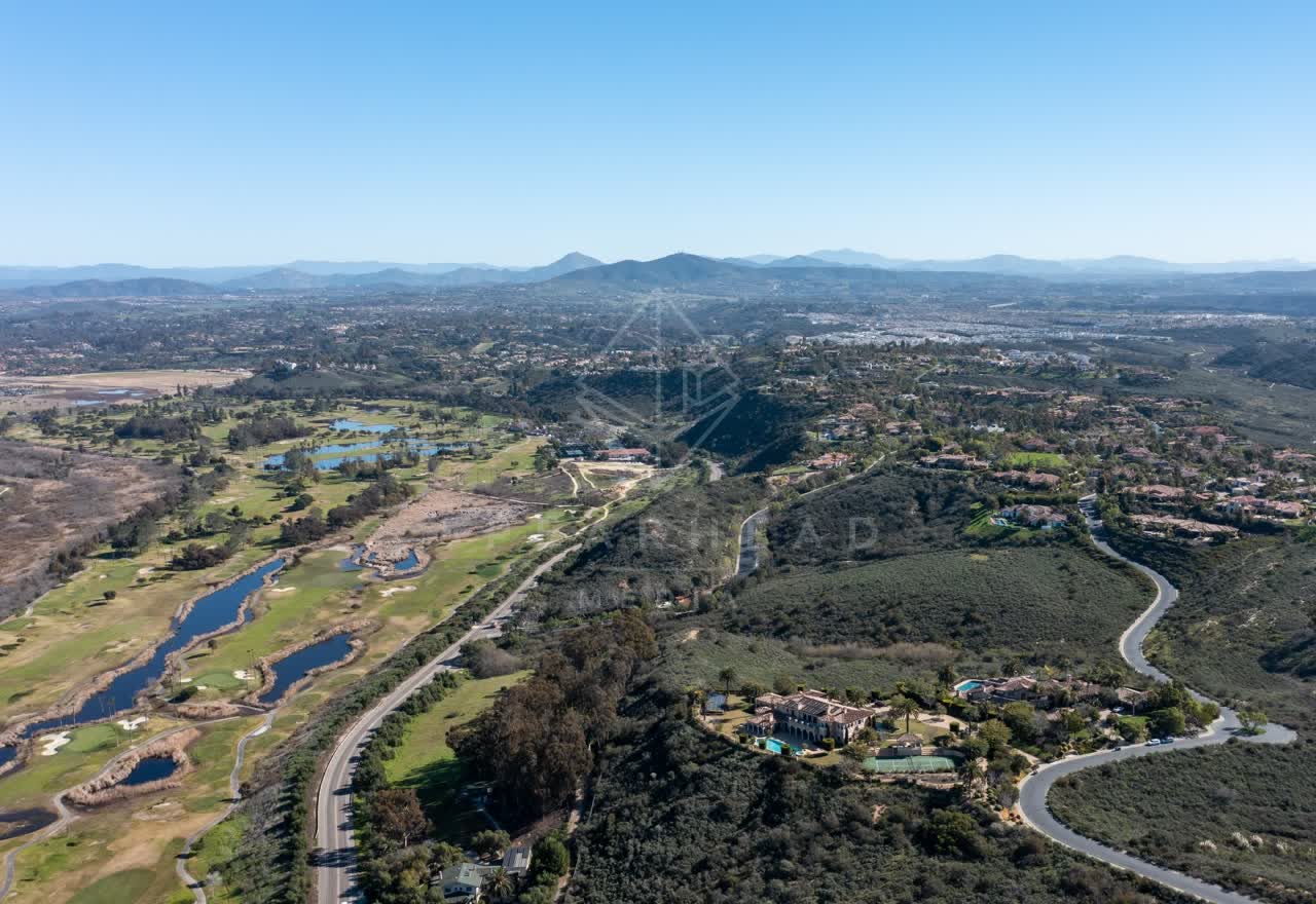 Aerial view of a residential street, homes and traffic at Rancho Pacifica.