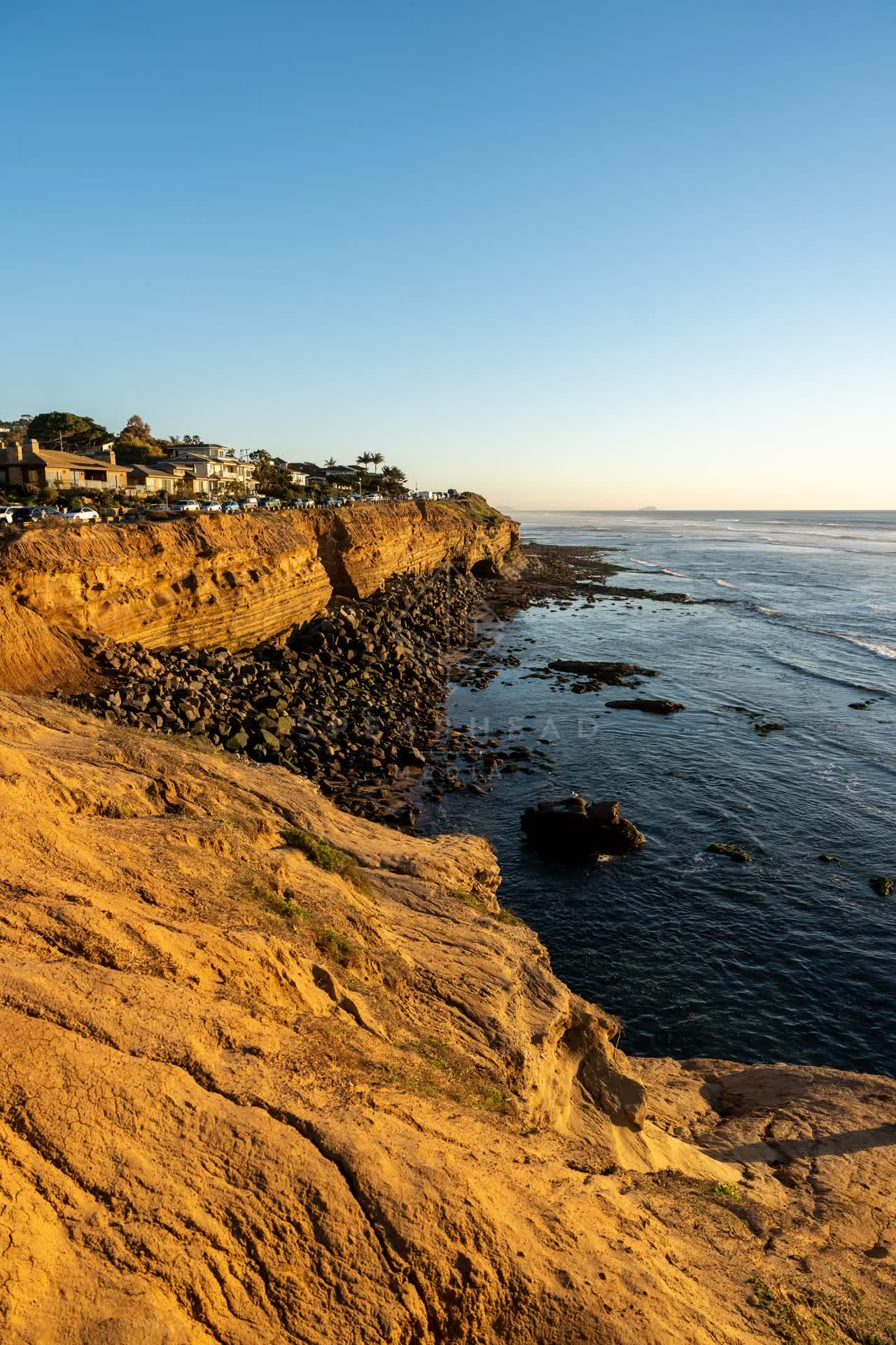 Elevated view of the cliffs, the ocean and homes at Sunset Cliffs.