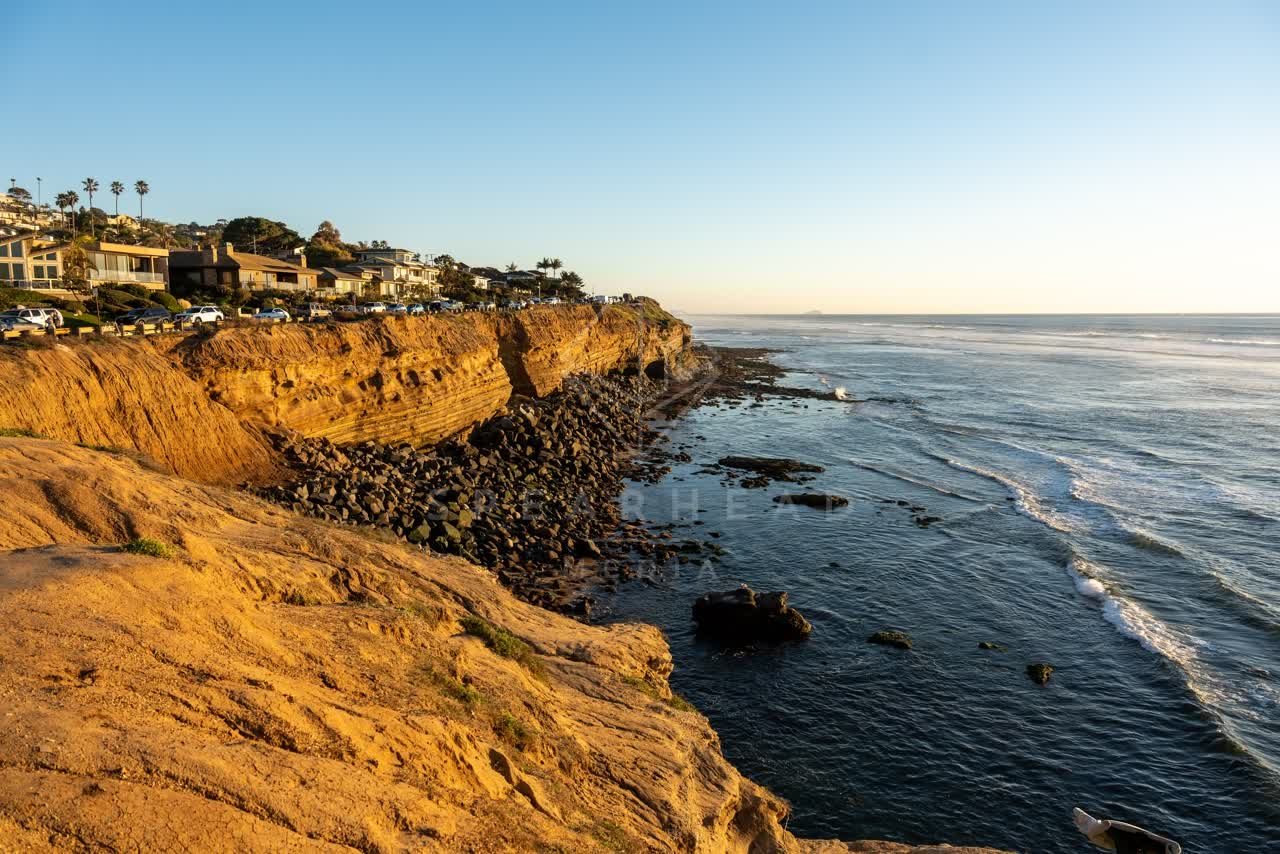 Elevated view of the cliffs, palm trees and the ocean at Sunset Cliffs.