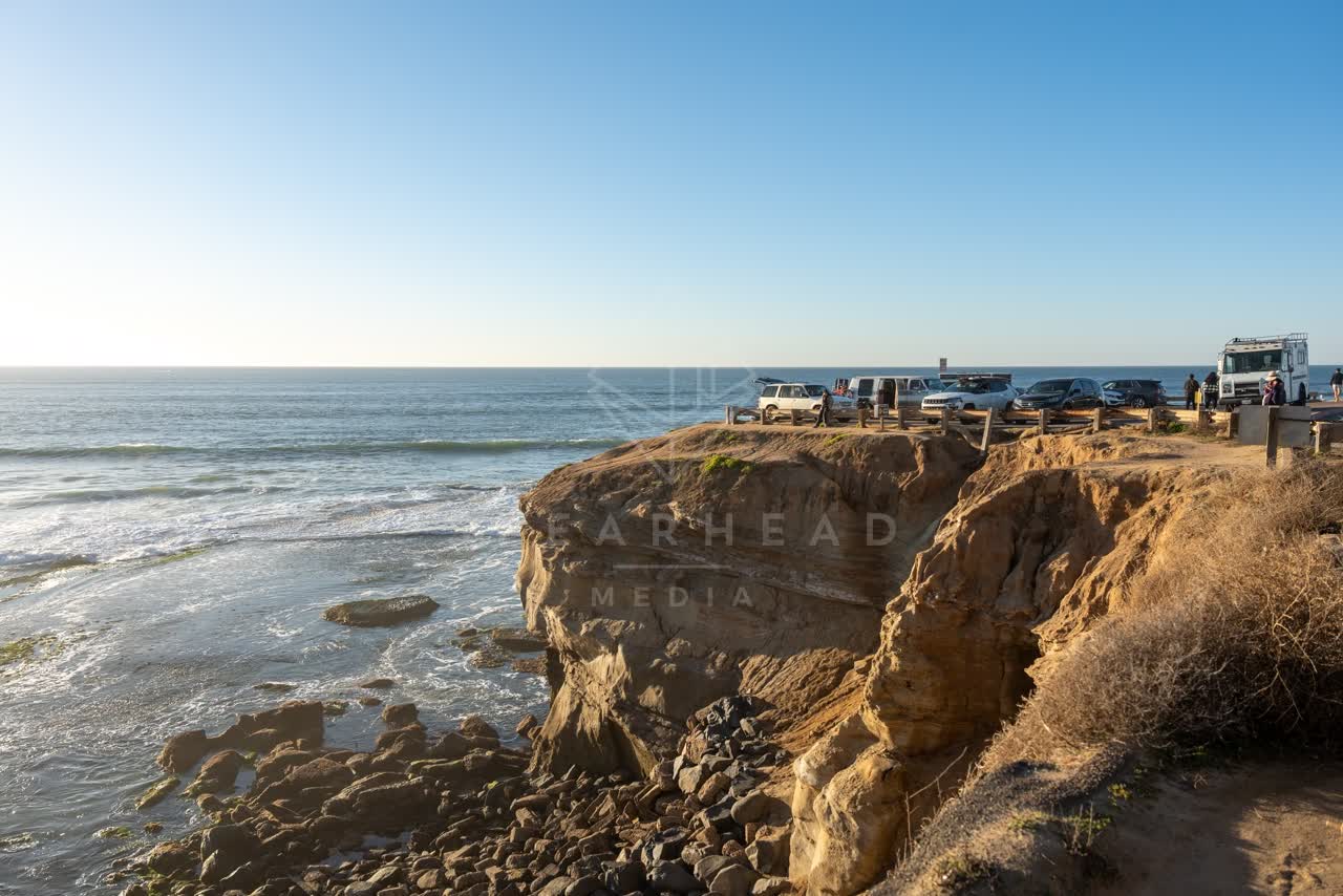 Elevated view of the cliffs, the surf and the ocean at Sunset Cliffs.