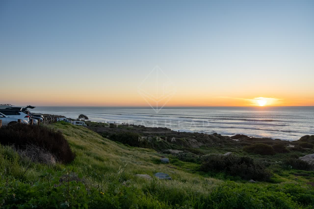 Elevated view of the cliffs, the ocean and traffic at Sunset Cliffs.