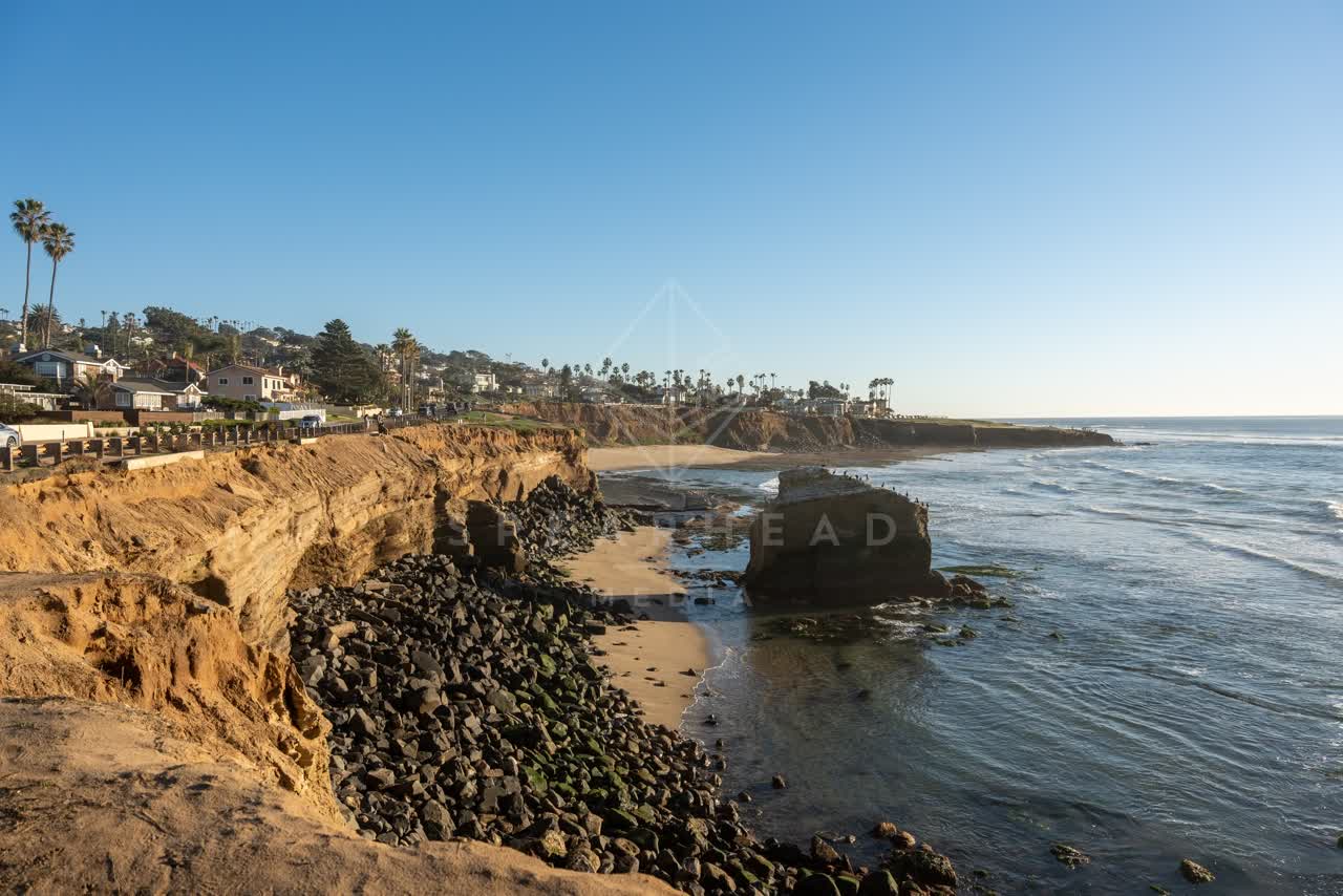 Elevated view of the cliffs, palm trees and the ocean at Sunset Cliffs.