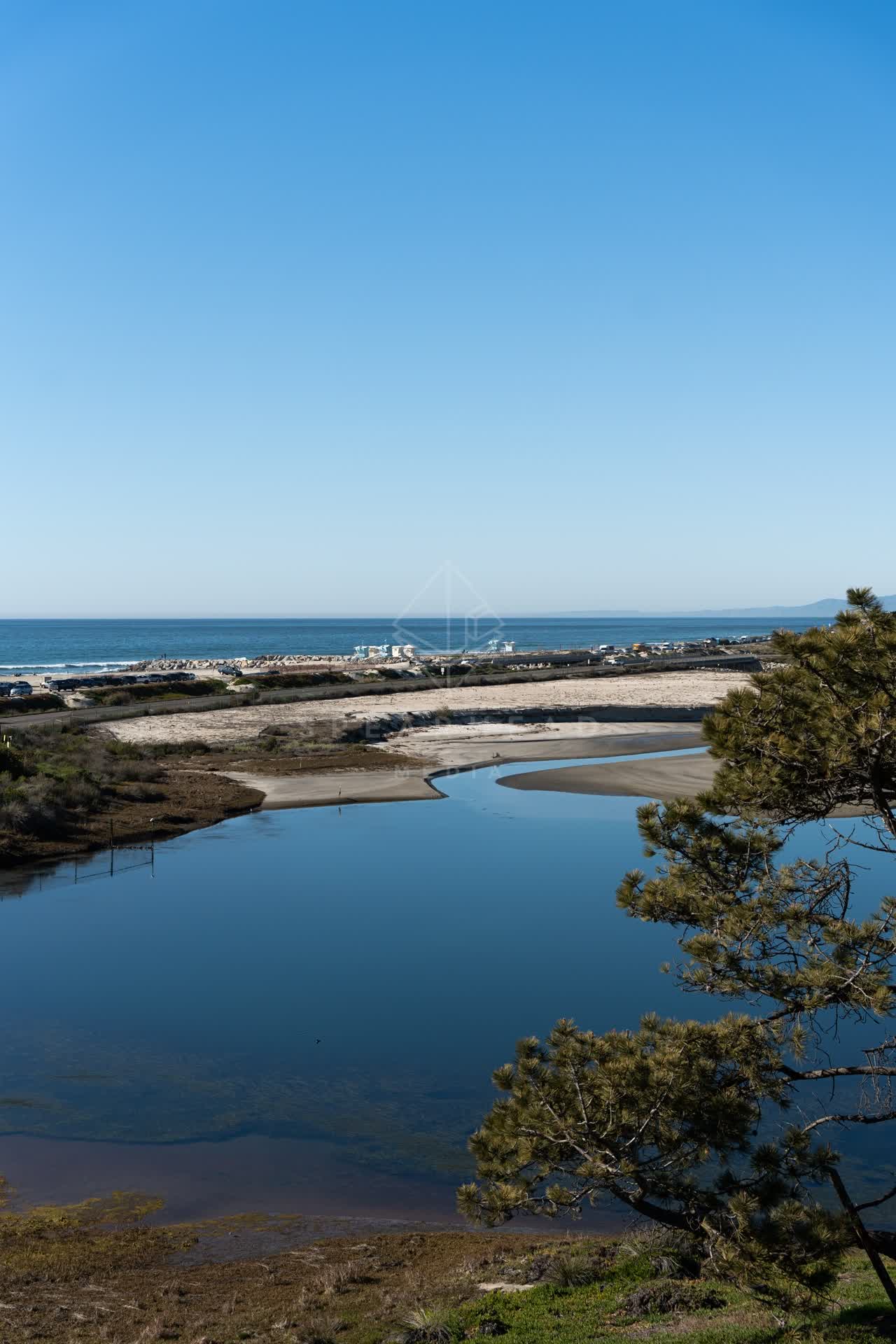 Elevated view of the beach, the ocean and traffic in Cardiff.