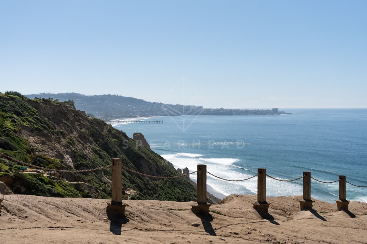 Elevated view of the cliffs, the pier and the ocean at Torrey Pines.
