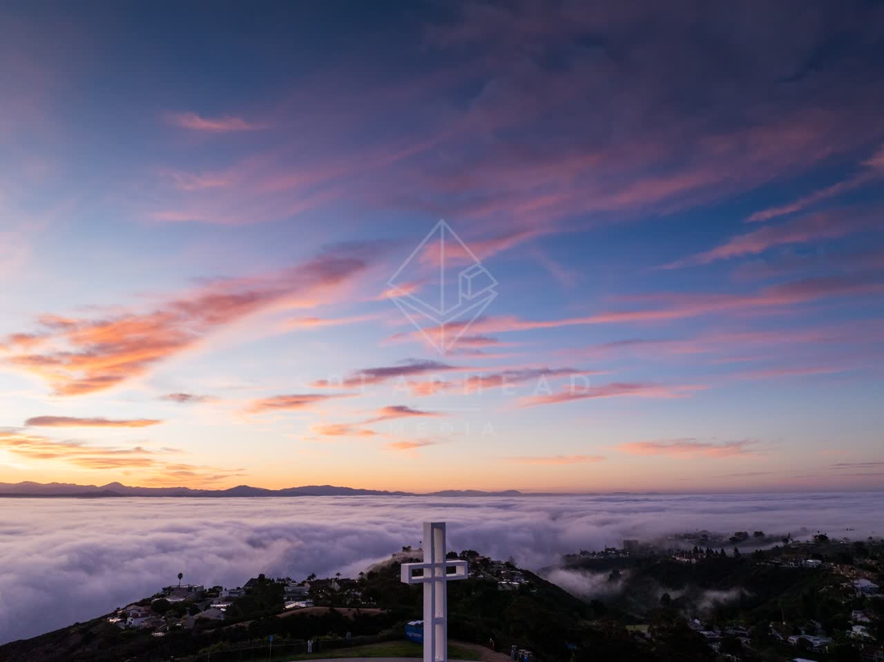 Elevated view of the cliffs, homes and open country at Mount Soledad.
