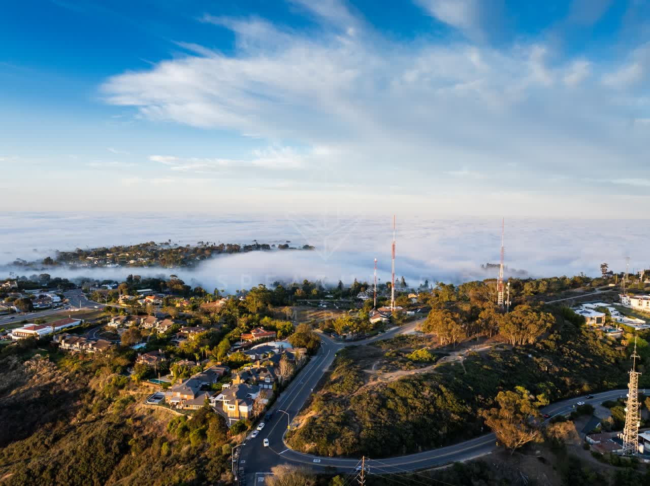 Aerial view of a residential street, homes and traffic at Mount Soledad.