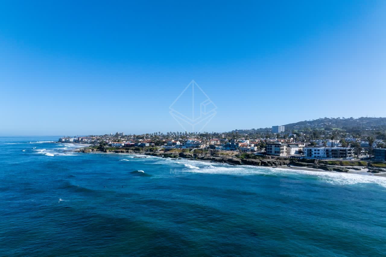Aerial view of the cliffs, the surf and the ocean at Windansea.