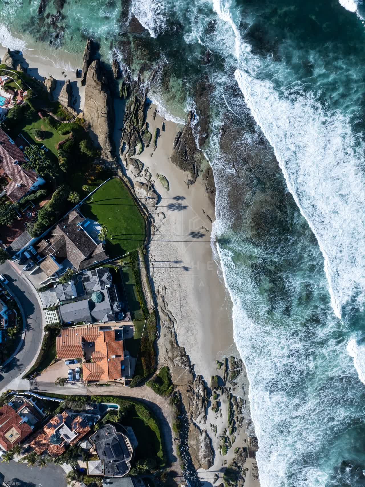 Aerial view of the beach, the surf and the ocean at Windansea.