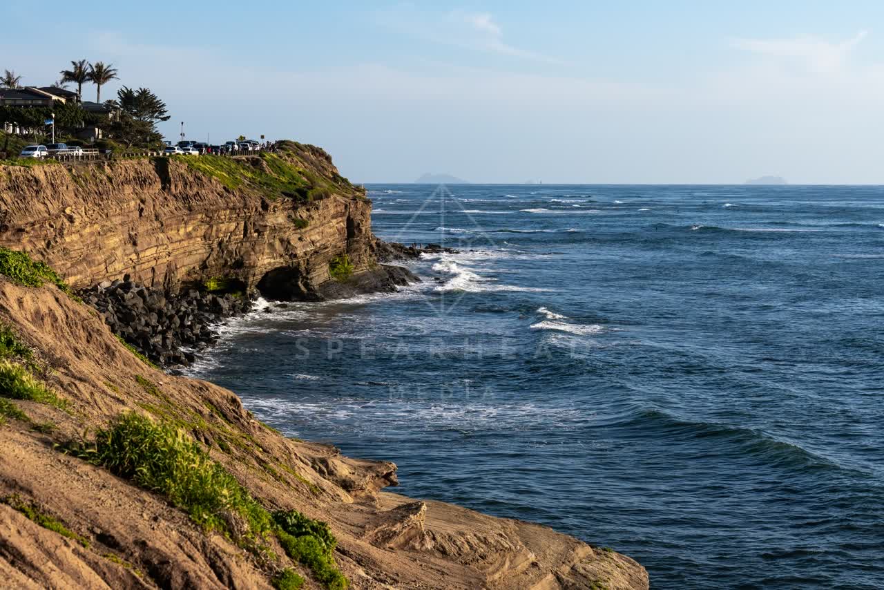 Elevated view of the cliffs, palm trees and the ocean at Sunset Cliffs.