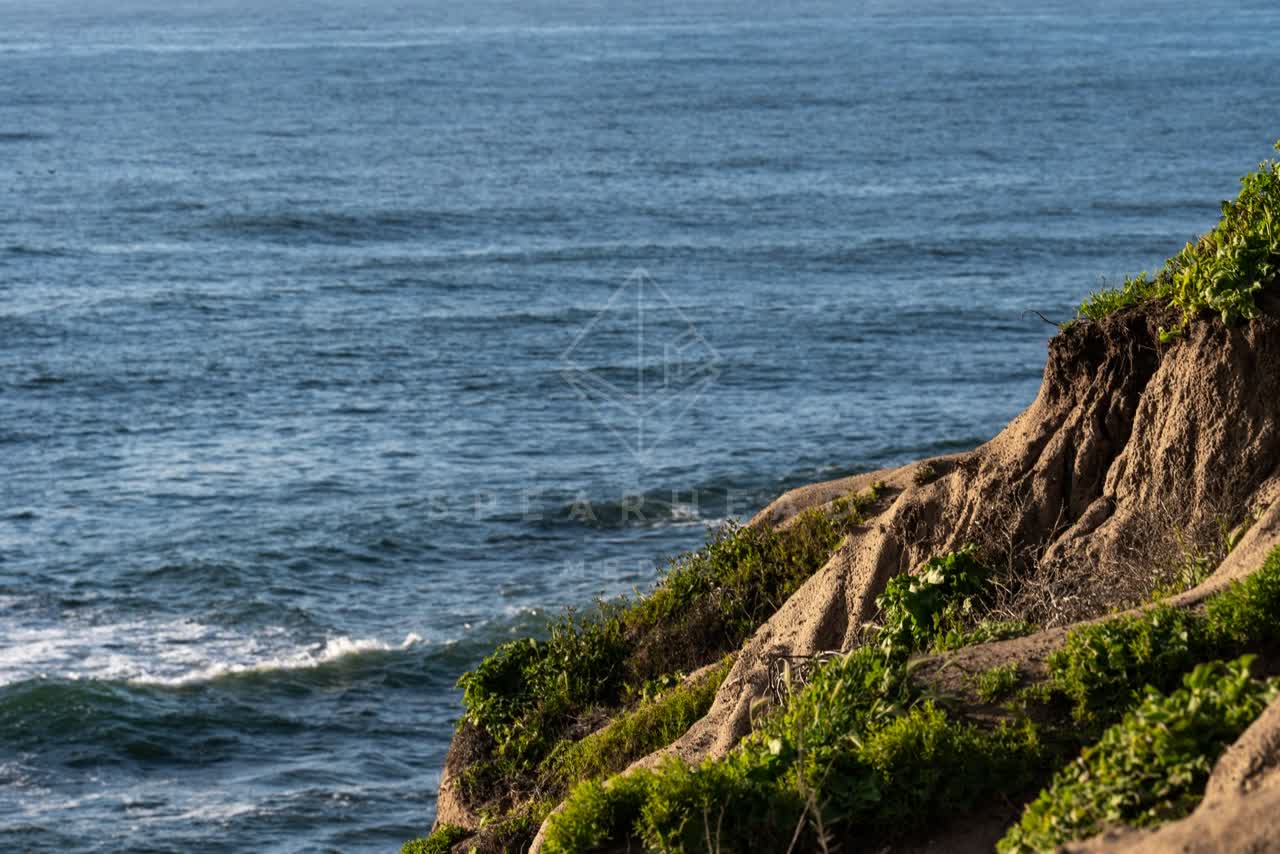 Elevated view of the cliffs, the ocean and open country at Sunset Cliffs.