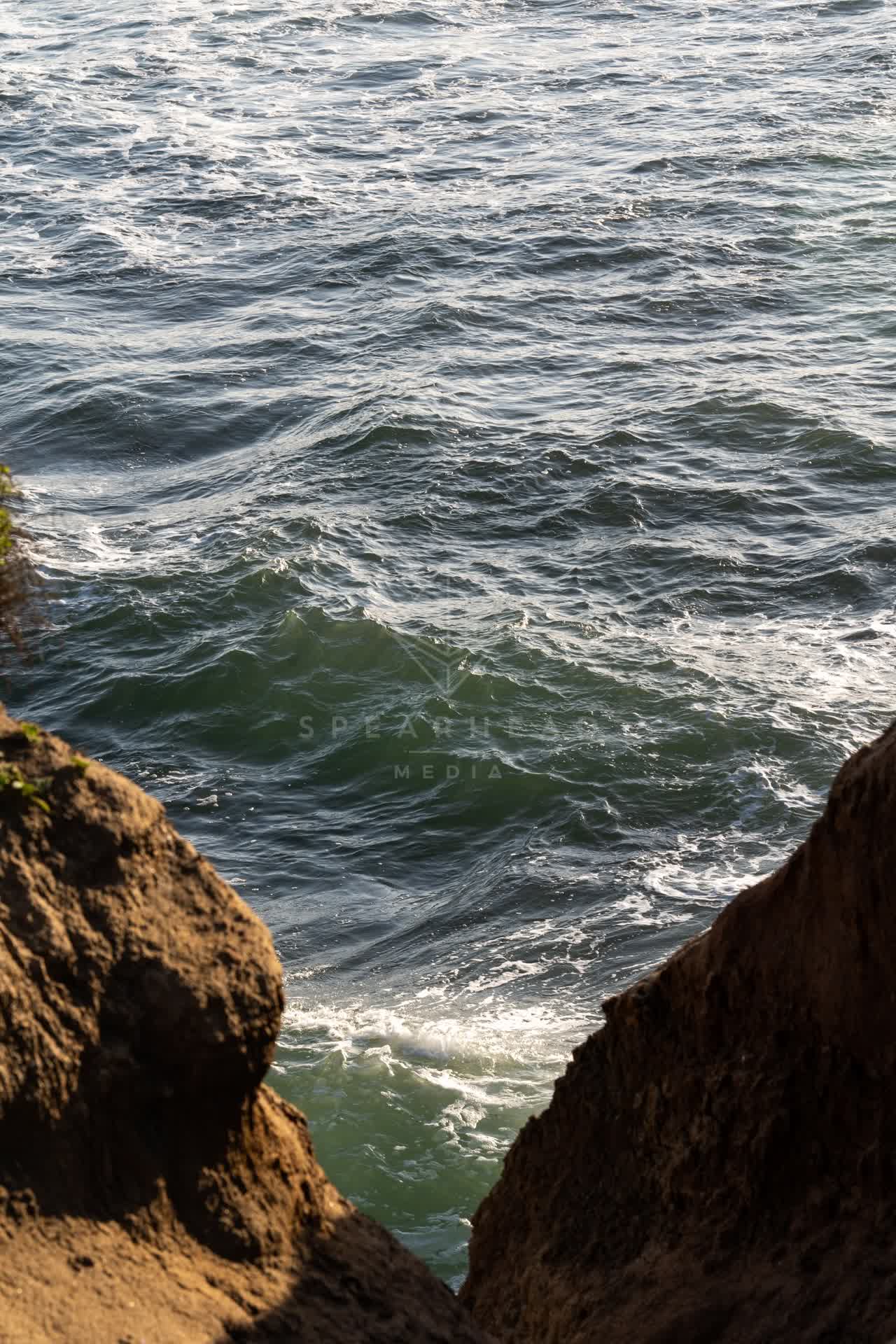 Elevated view of the cliffs, the ocean and open country at Sunset Cliffs.