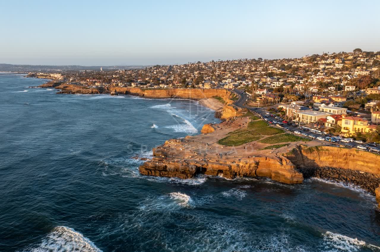 Aerial view of the cliffs, the surf and the ocean at Sunset Cliffs.