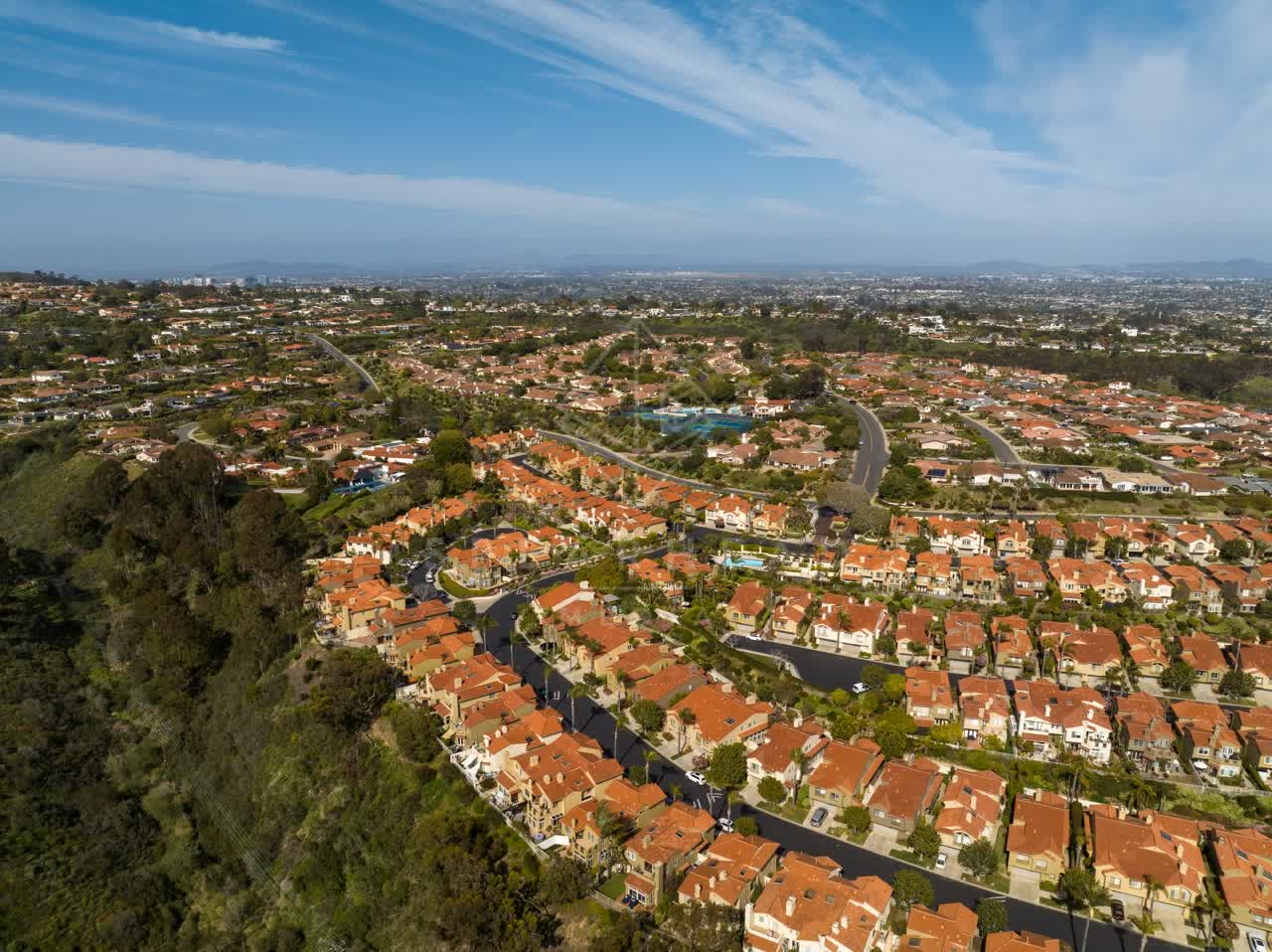 Aerial view of a residential street, homes and the buildings at La Jolla Alta.