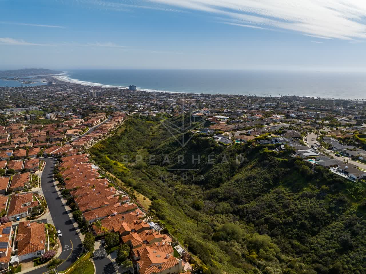 Aerial view of a residential street, the ocean and homes at La Jolla Alta.