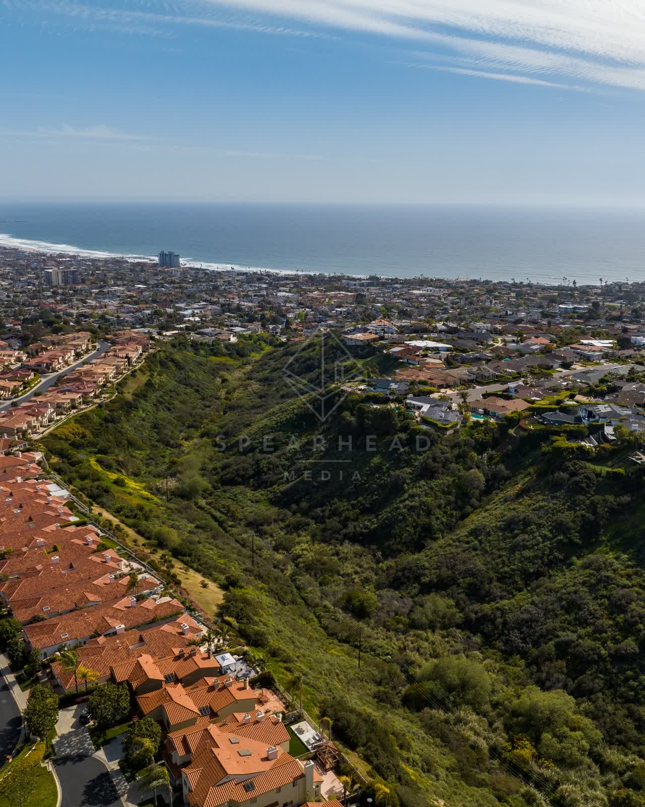 Aerial view of a residential street, the ocean and homes at La Jolla Alta.
