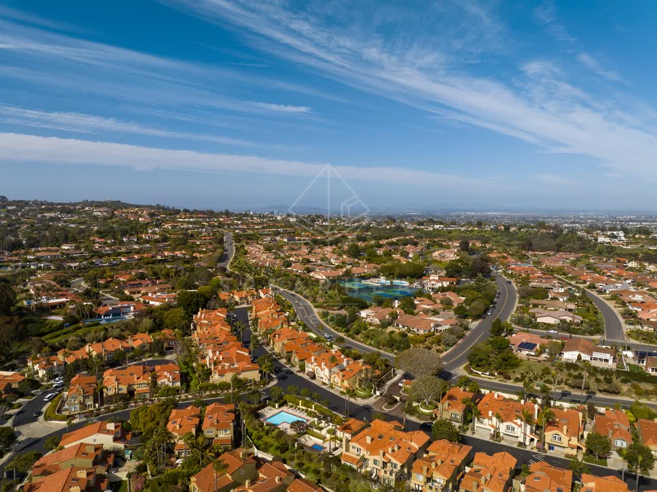 Aerial view of a residential street, homes and the buildings at La Jolla Alta.
