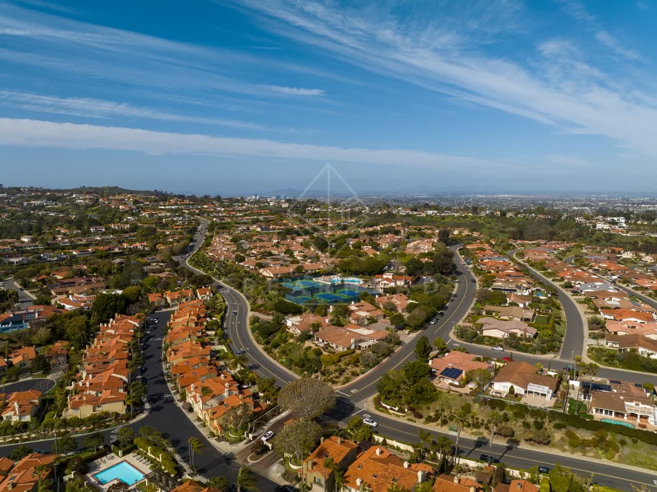 Aerial view of a residential street, homes and the buildings at La Jolla Alta.