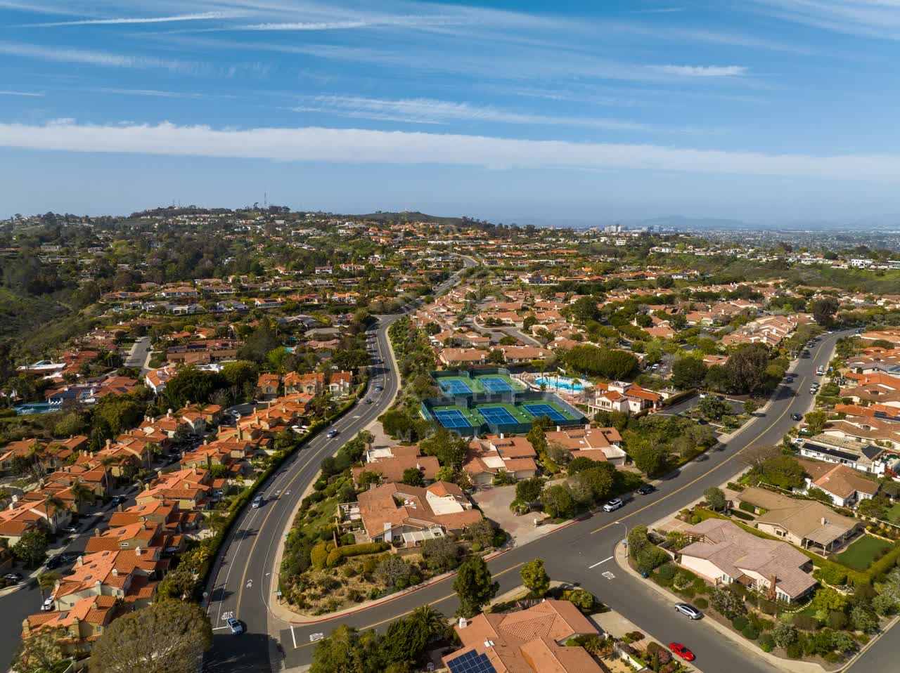Aerial view of a residential street, homes and traffic at La Jolla Alta.