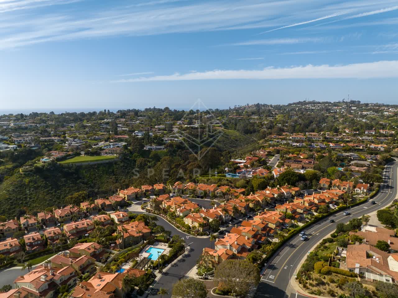 Aerial view of a residential street, the ocean and homes at La Jolla Alta.