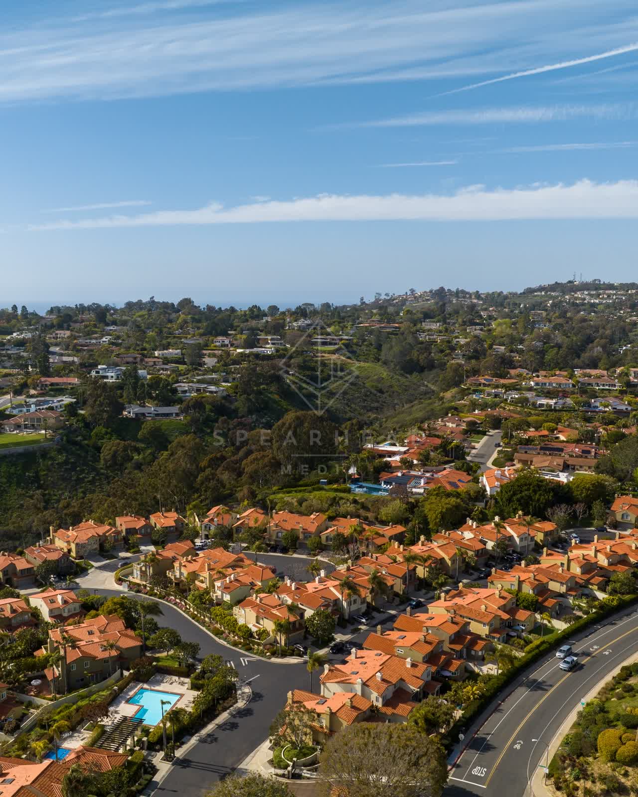 Aerial view of a residential street, homes and traffic at La Jolla Alta.