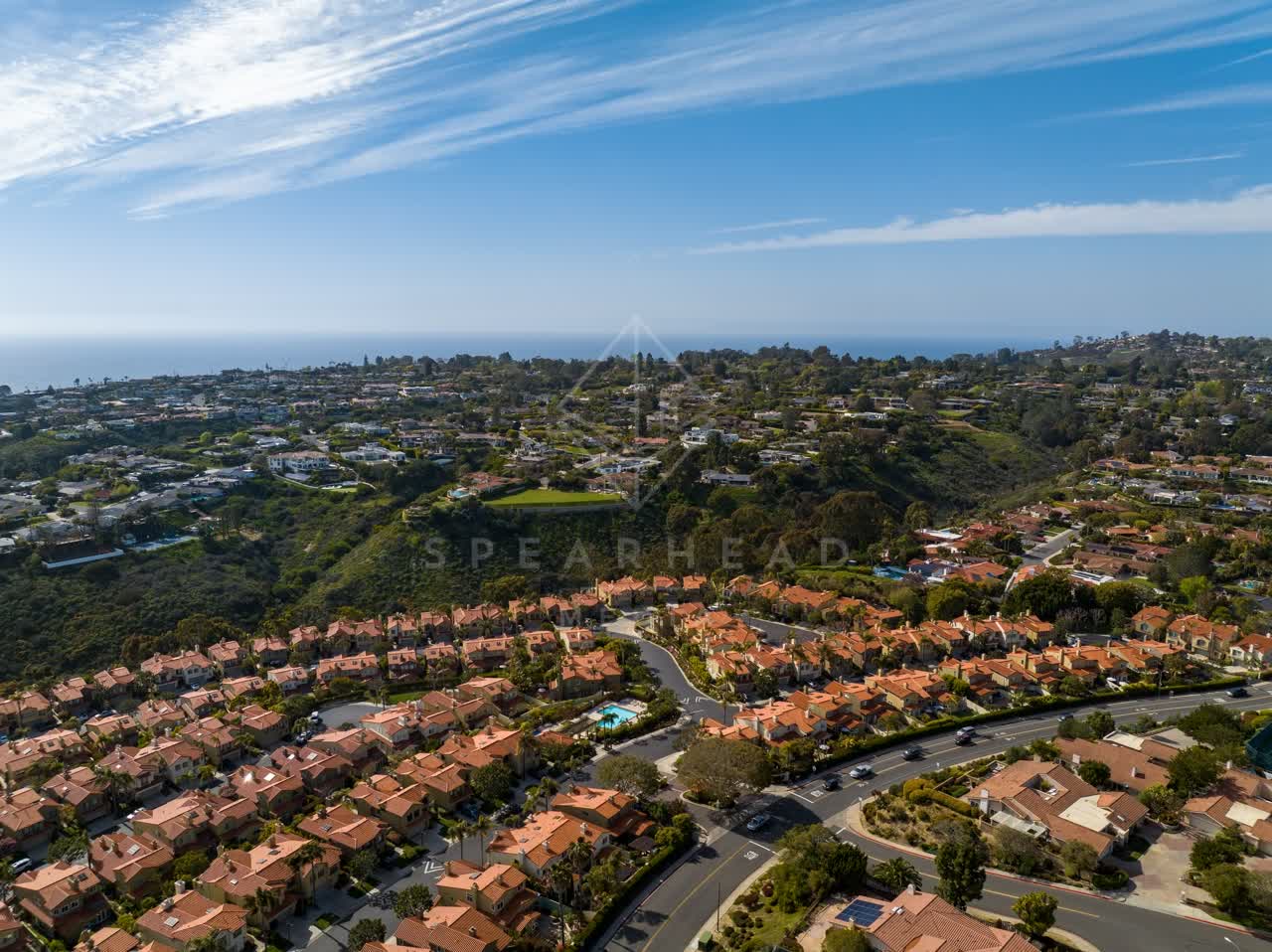 Aerial view of a residential street, the ocean and homes at La Jolla Alta.