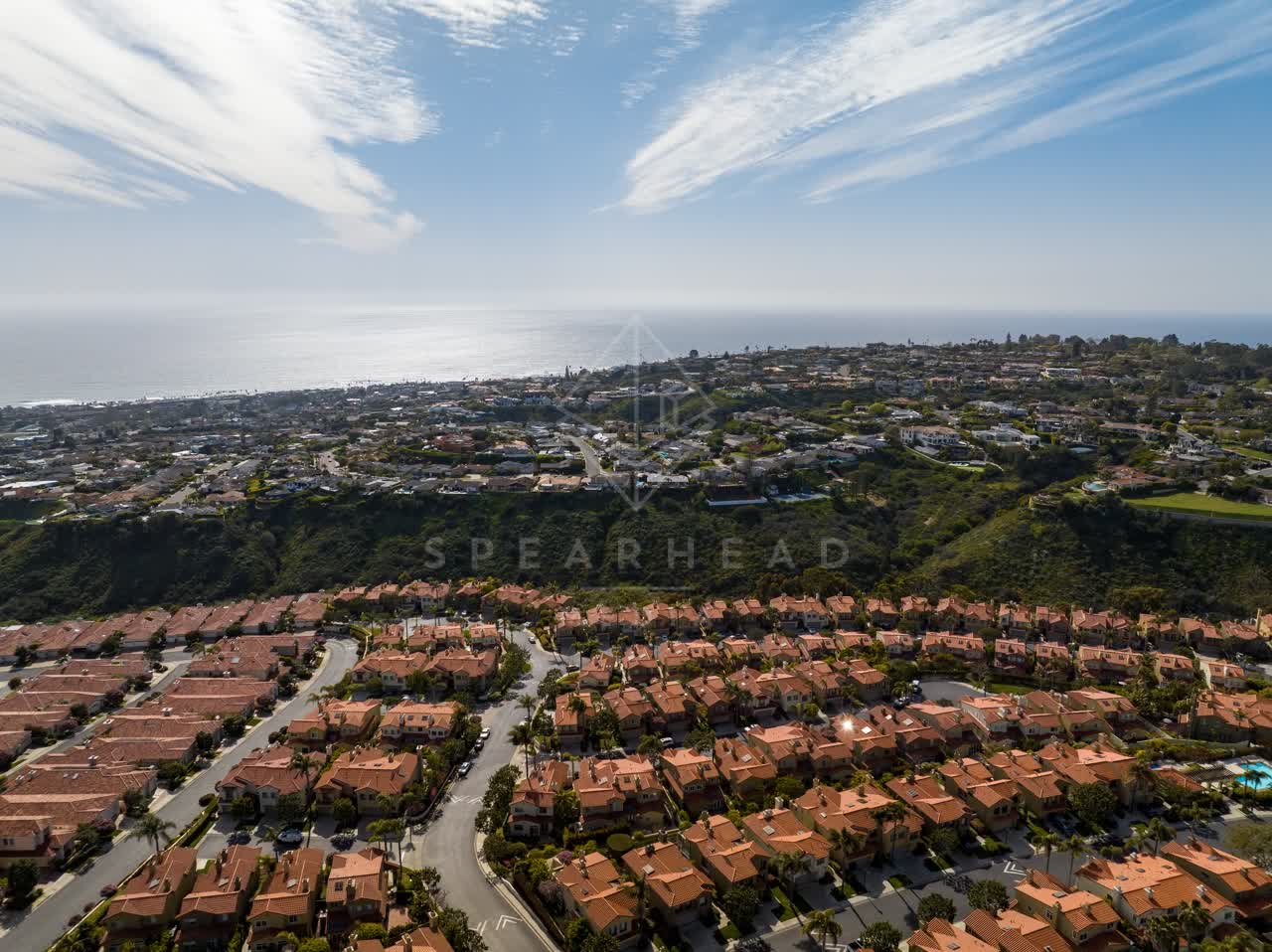 Aerial view of a residential street, the ocean and homes at La Jolla Alta.