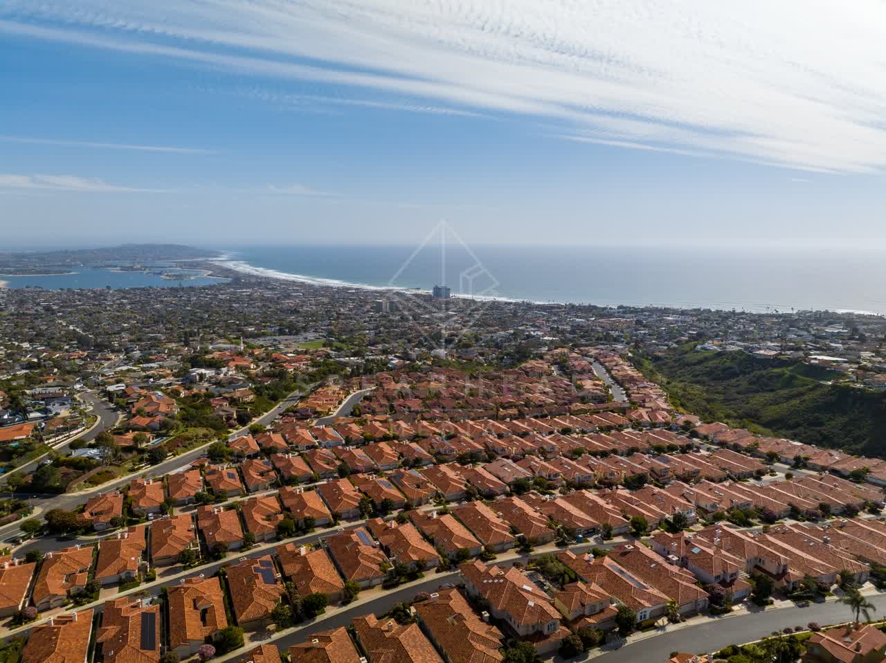 Aerial view of a residential street, the ocean and homes at La Jolla Alta.