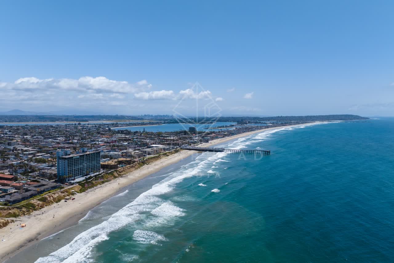 Aerial view of the beach, the surf and the pier at Tourmaline.