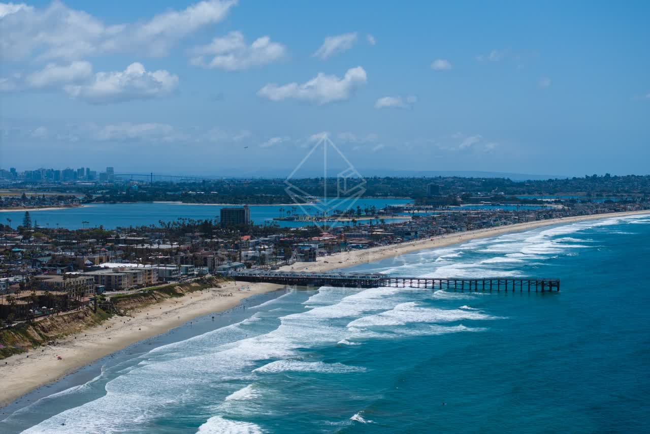 Aerial view of the beach, the surf and the pier at Tourmaline.