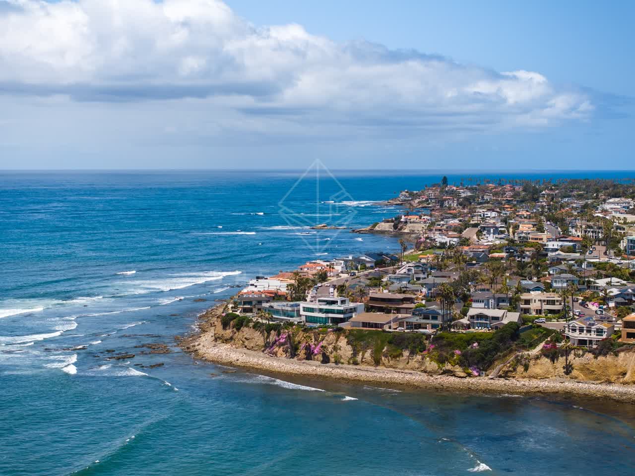 Aerial view of the cliffs, the ocean and homes at Bird Rock.