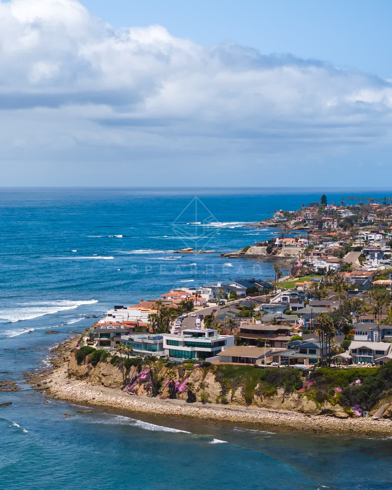 Aerial view of the cliffs, the ocean and homes at Bird Rock.