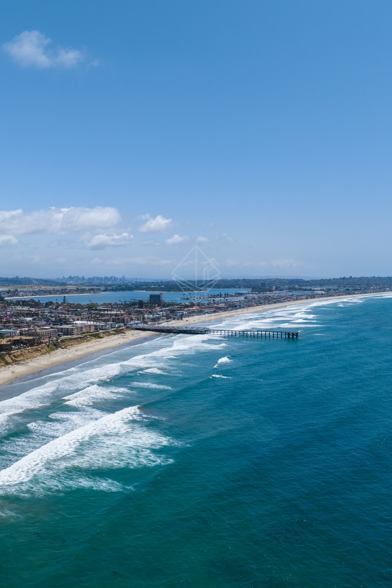 Aerial view of the beach, the surf and the pier at Tourmaline.