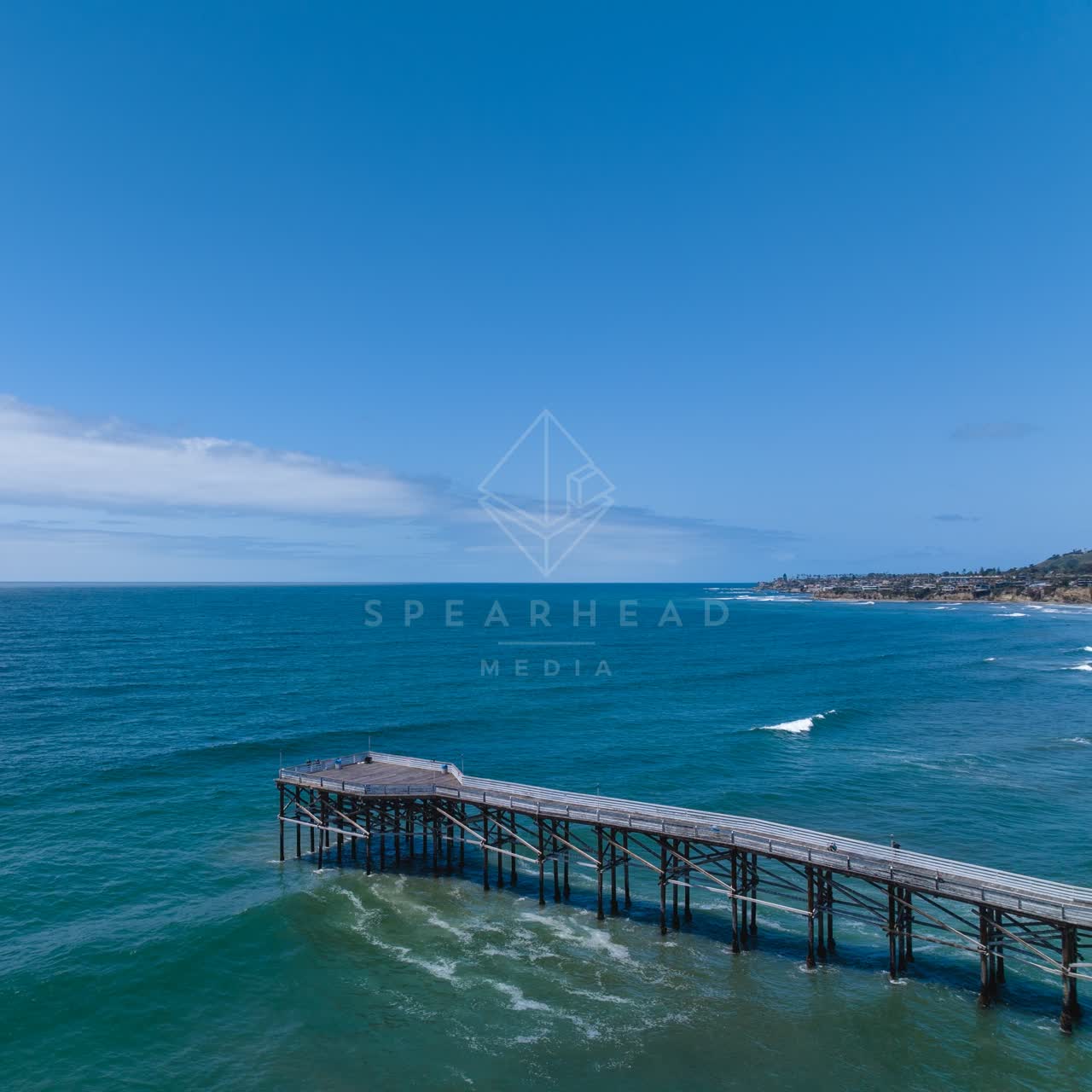 Aerial view of the beach, the surf and the pier at Tourmaline.