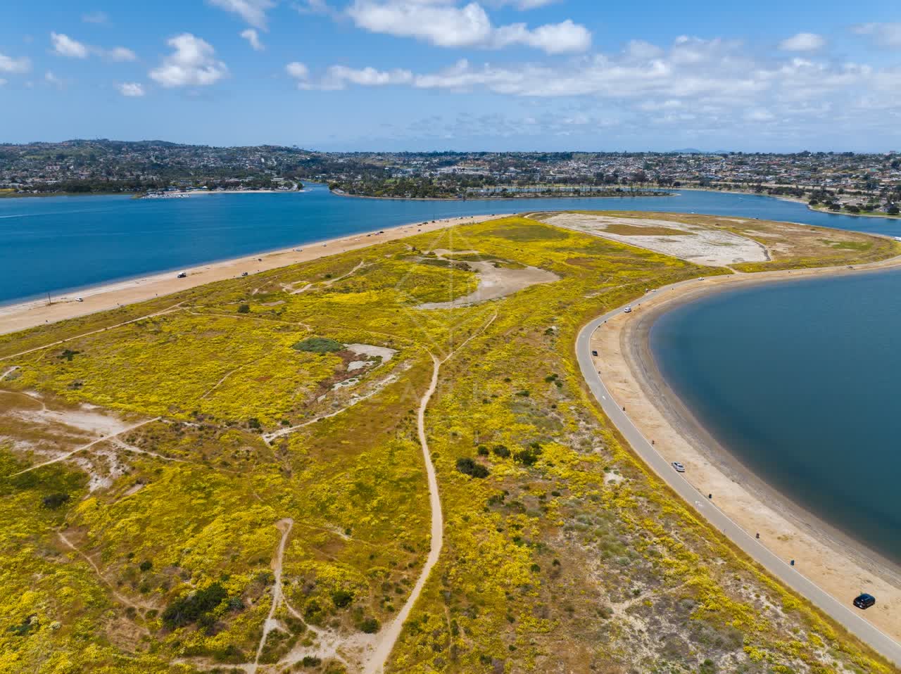Aerial view of the country inland, the bay and homes in Mission Bay.