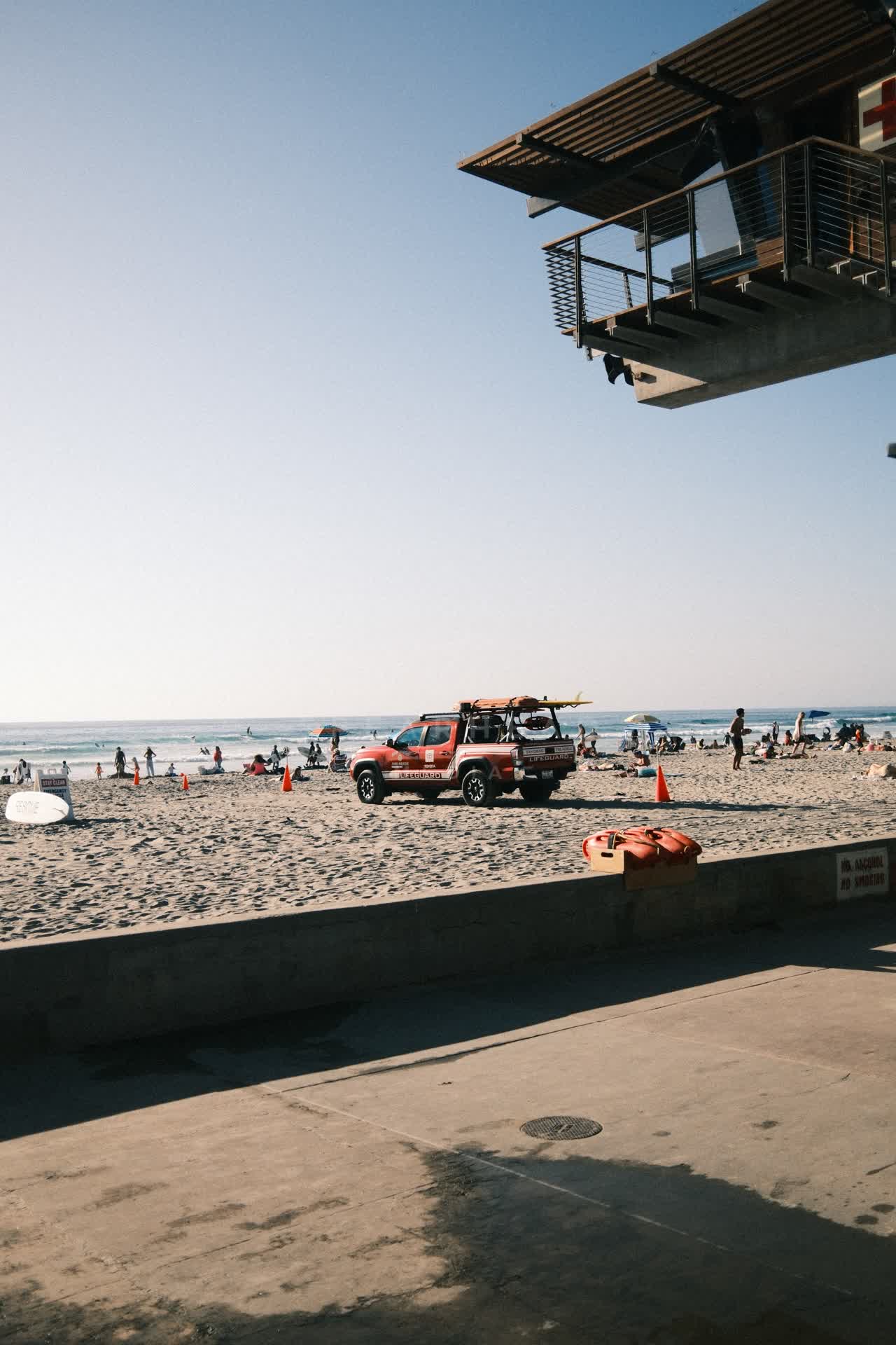 The beach, the surf and the ocean at La Jolla Shores, with people walking.