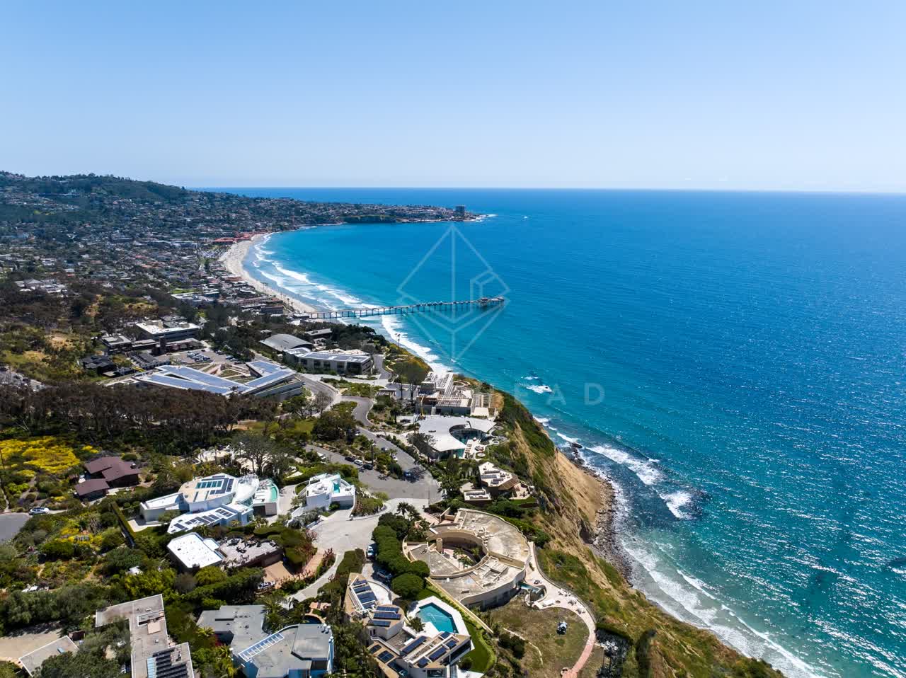 Aerial view of the cliffs, the pier and the ocean at Black’s Beach.