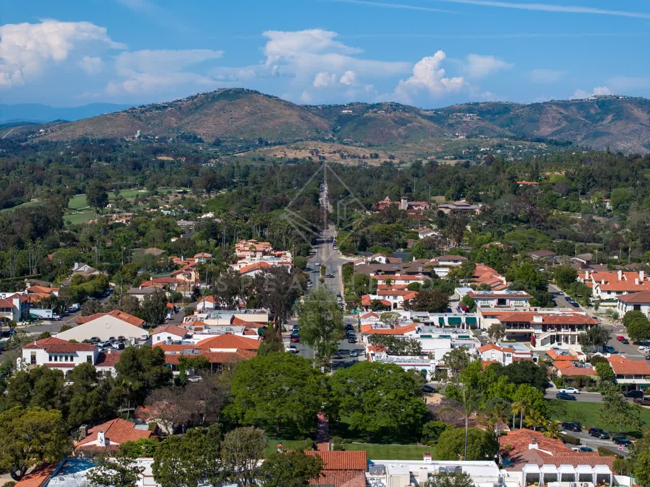 Aerial view of a residential street, homes and the buildings at Covenant.