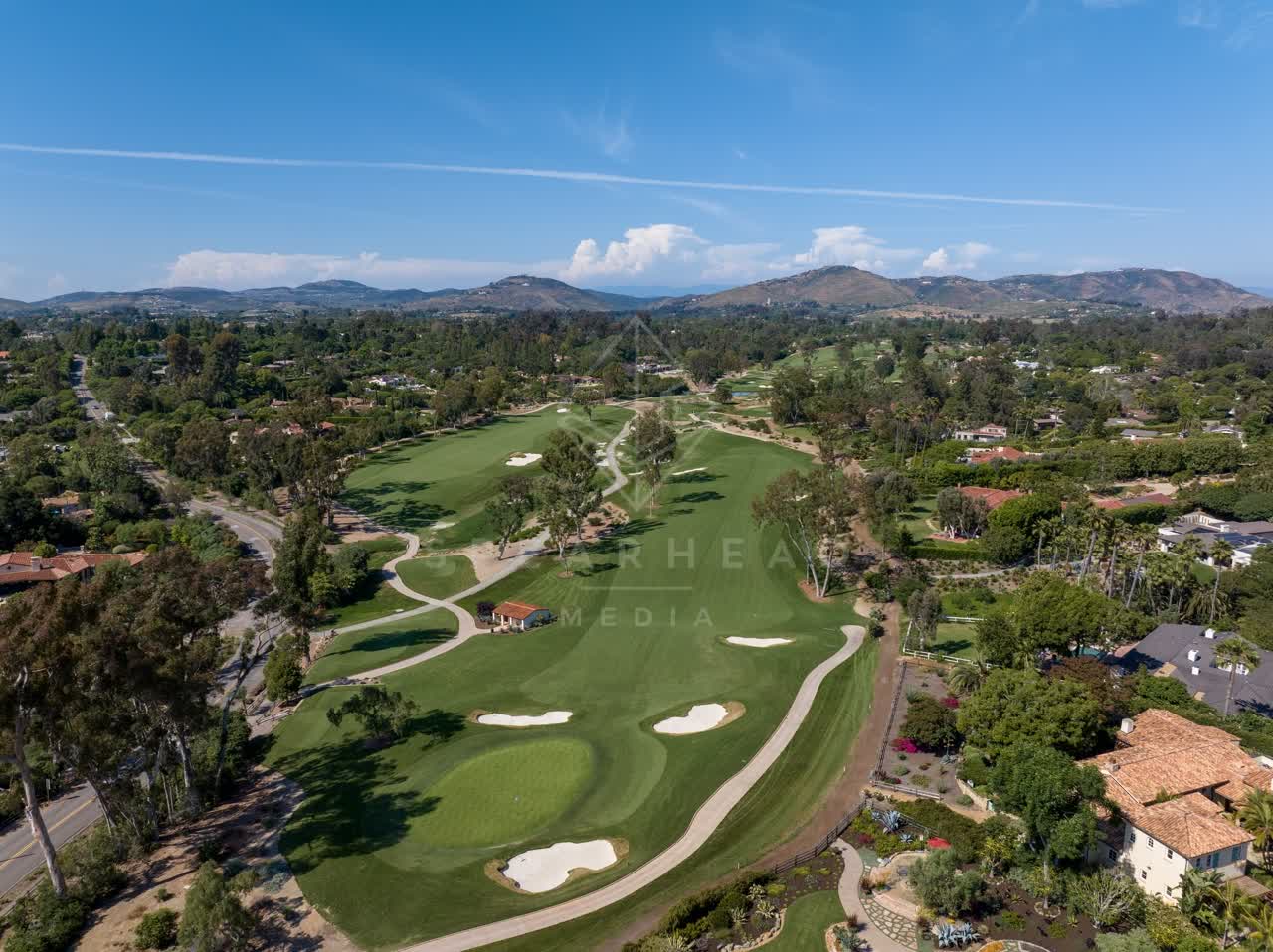 Aerial view of the country inland, palm trees and homes at Covenant.
