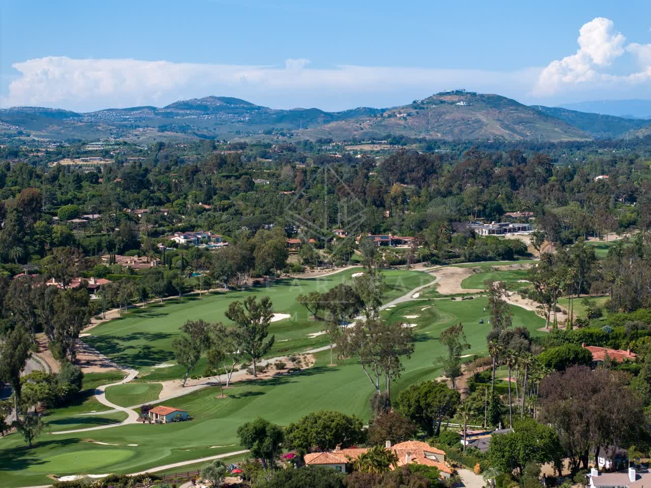 Aerial view of the country inland, palm trees and homes at Covenant.