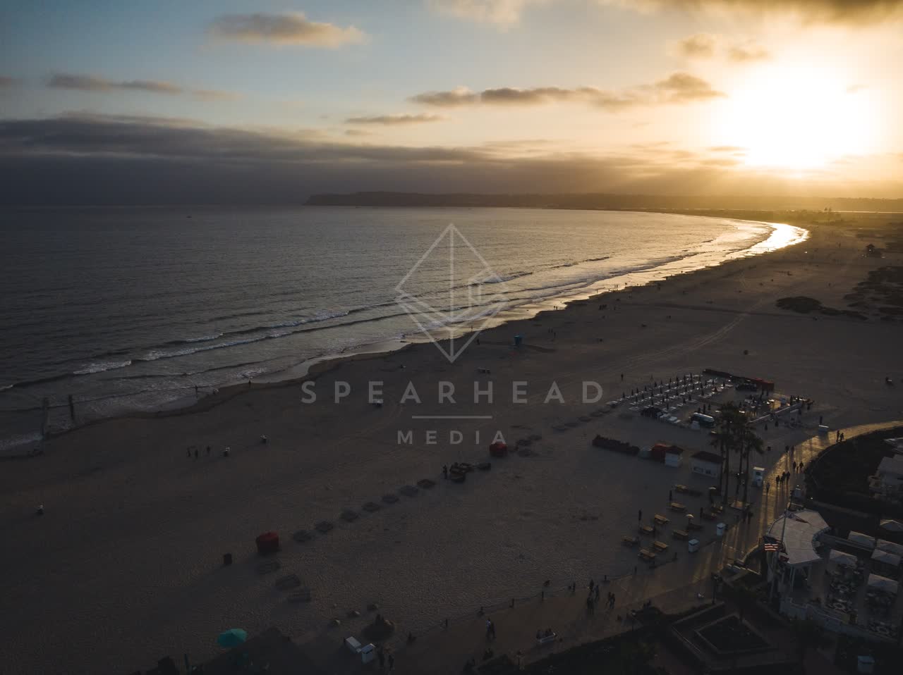 Aerial view of the beach, palm trees and the ocean at Coronado Beach.