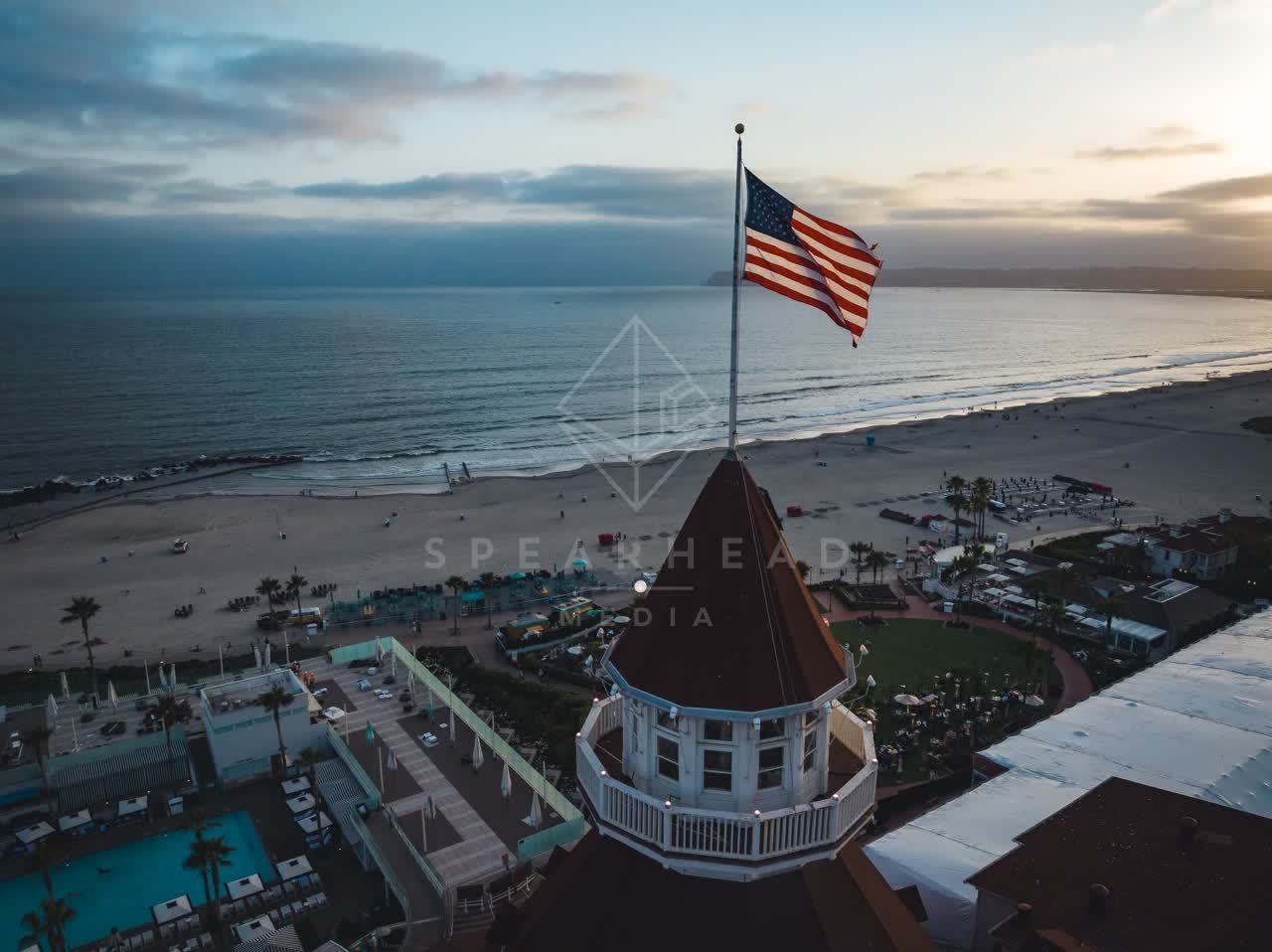 Aerial view of the beach, palm trees and the ocean at Coronado Beach.
