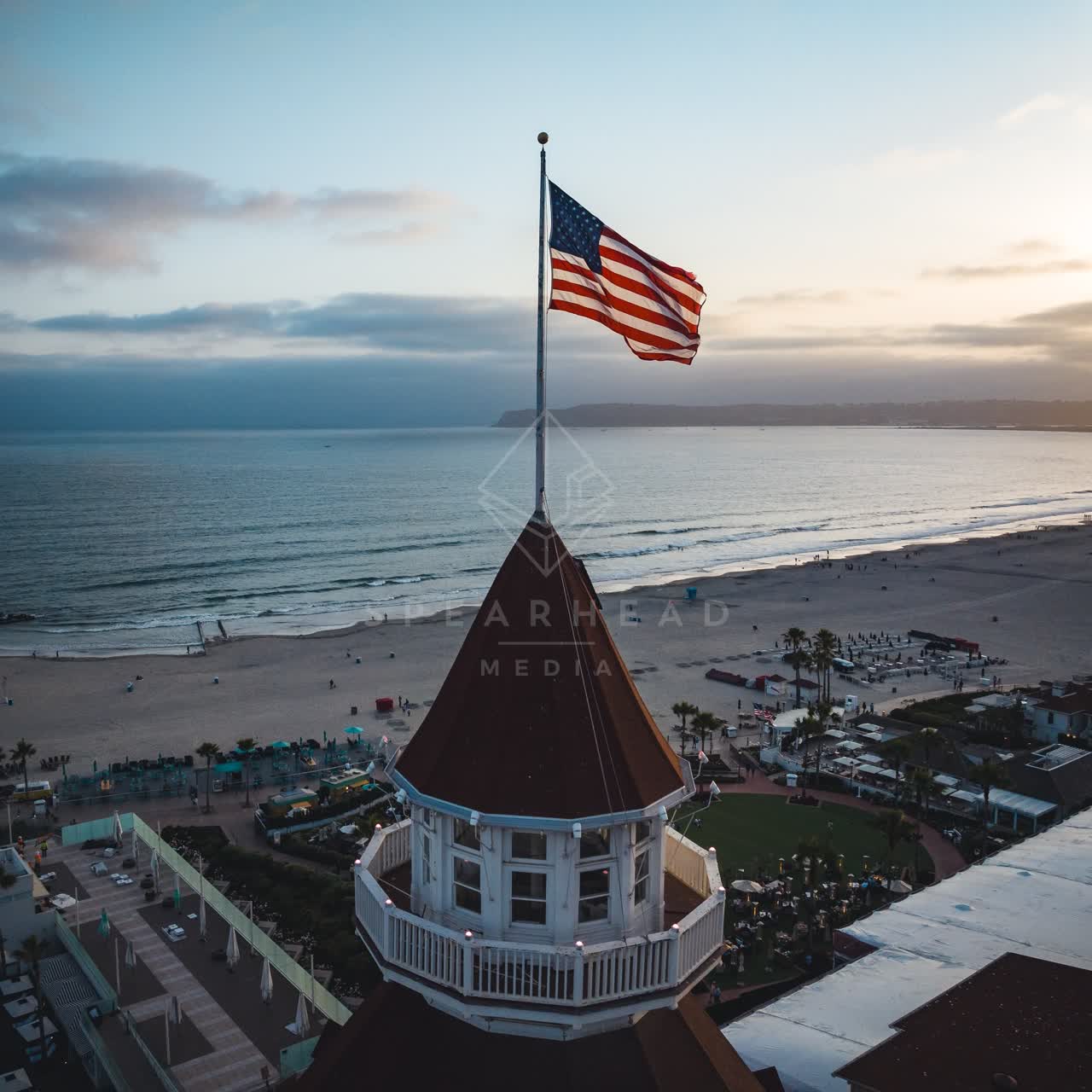 Aerial view of the beach, palm trees and the ocean at Coronado Beach.