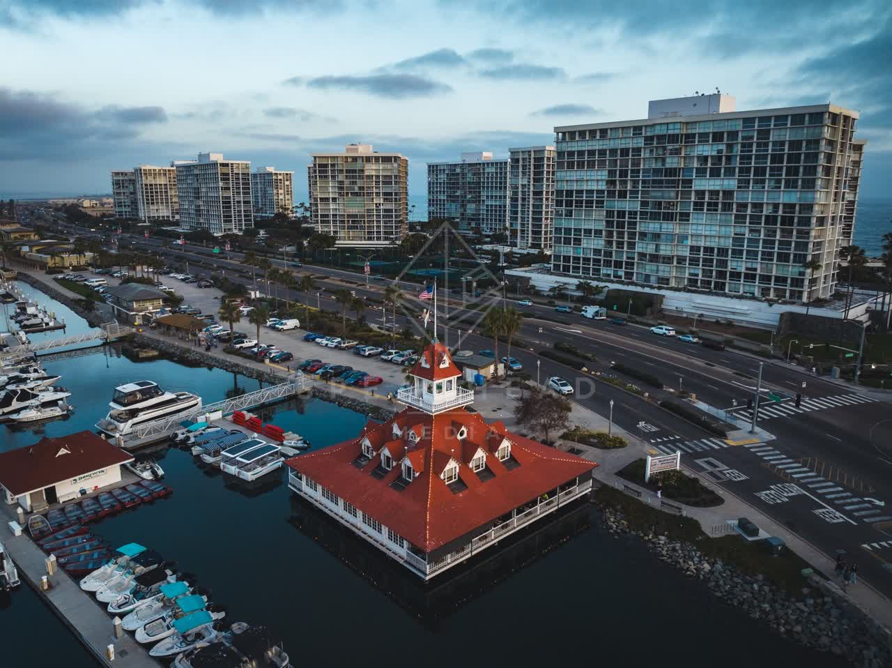 Aerial view of the harbor, boats and the bay at Coronado Beach, with boats out.