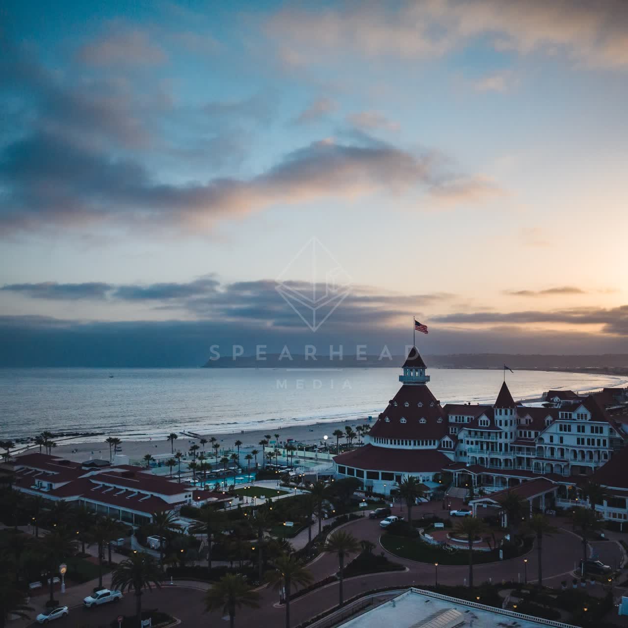 Aerial view of the beach, palm trees and the ocean at Coronado Beach.